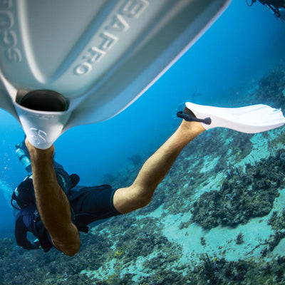 Scuba diver kicking fins underwater