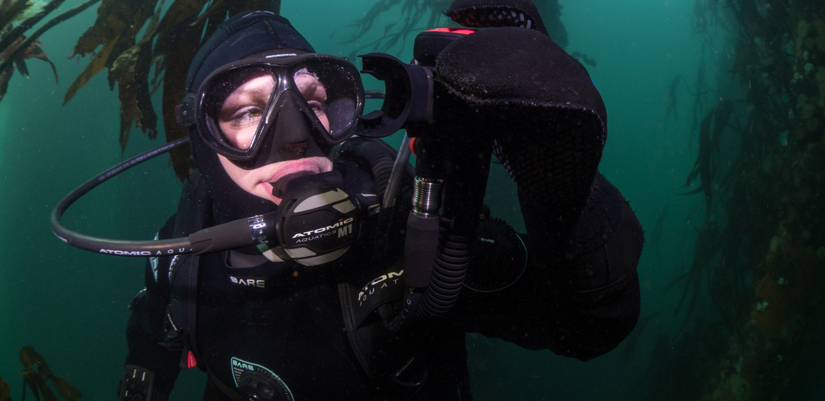 Diver holding up their integrated octo