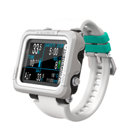 A digital dive computer with a white body and band, displaying various dive metrics on its screen.